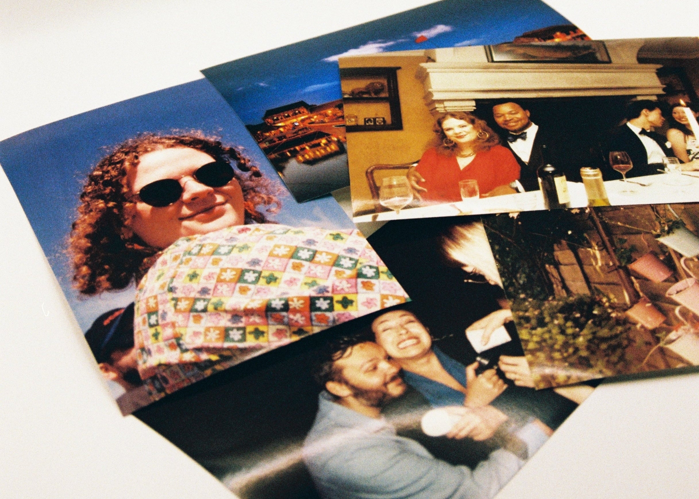 Collection of photographs on a white surface