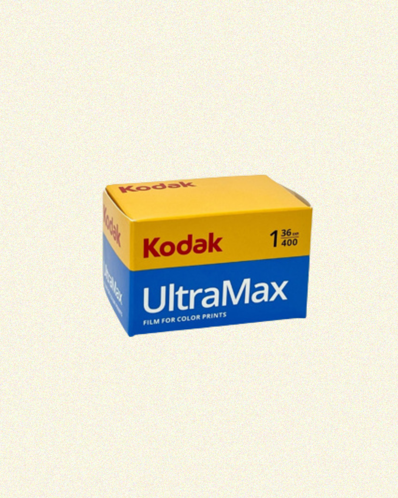 Kodak UltraMax film packaging on a beige background